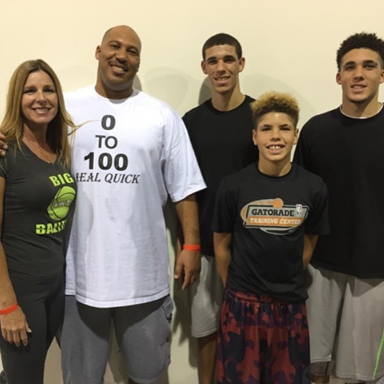 Tina Ball in black t-shirt, LaVar Ball in white t-shirt and their sons in black vests.